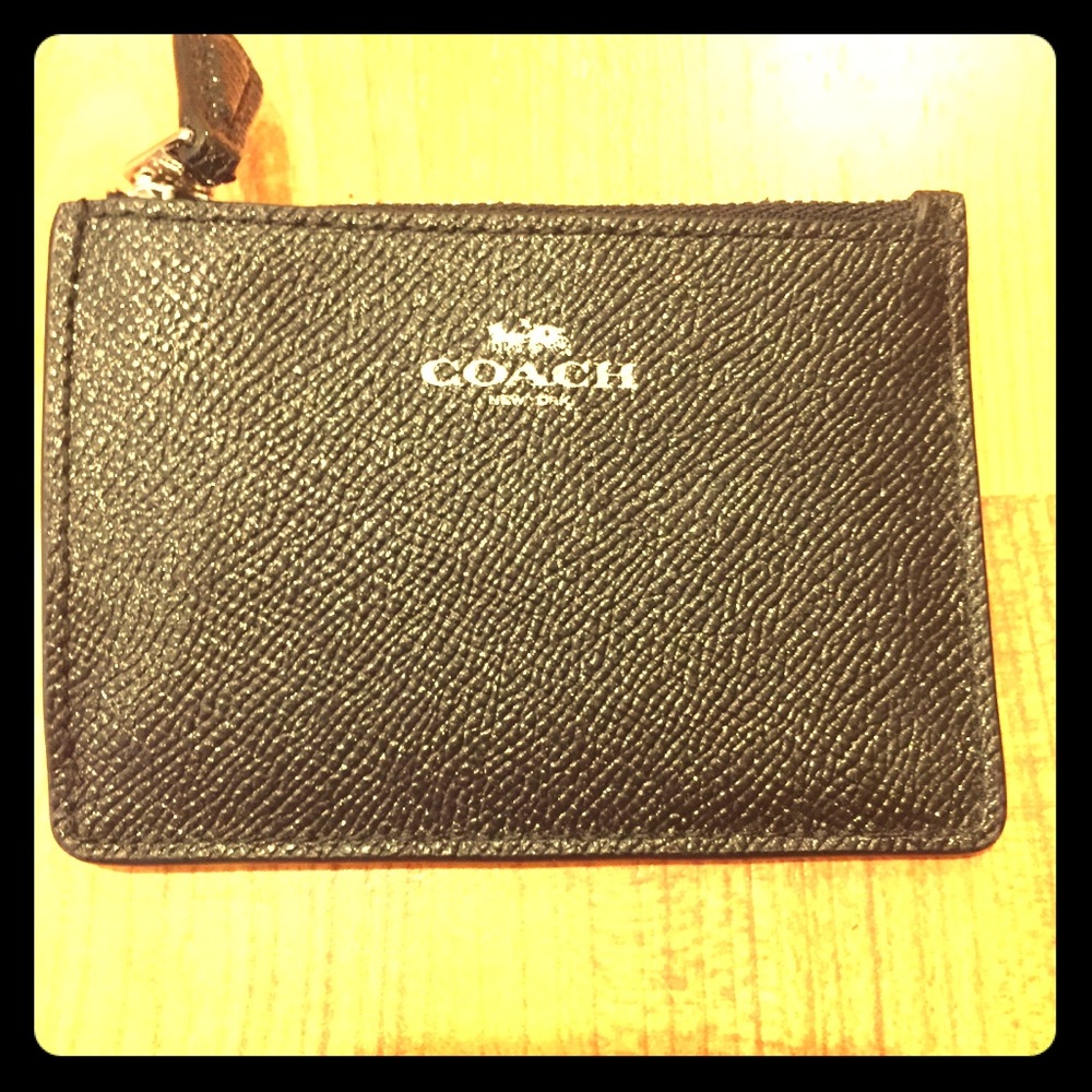 Never used Mini Skinny Coach ID case